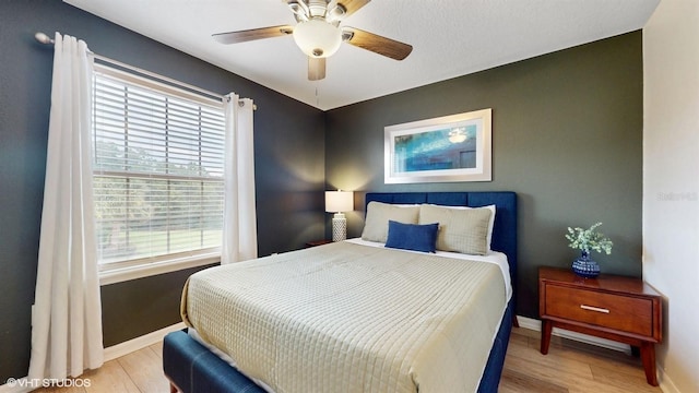 8806 Geneve Ct, Kissimmee, FL 34747 - bedroom featuring light wood-type flooring and a ceiling fan