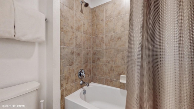 8806 Geneve Ct, Kissimmee, FL 34747 - bathroom with toilet and shower / tub combo with curtain