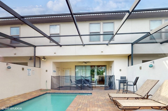 8806 Geneve Ct, Kissimmee, FL 34747 - back of house featuring a patio area, stucco siding, ceiling fan, and outdoor dining area