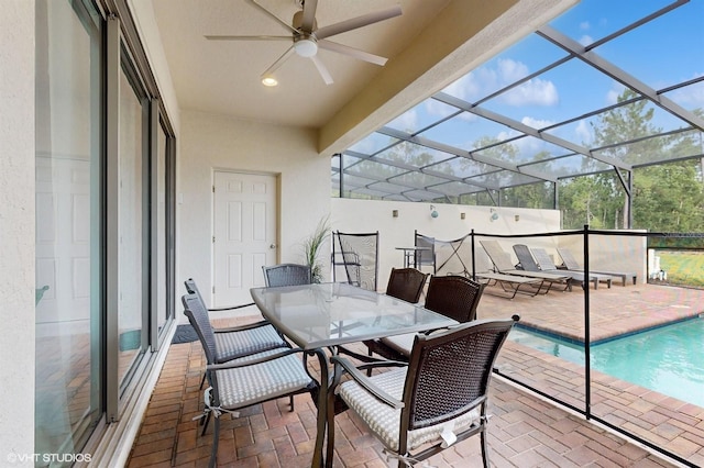 8806 Geneve Ct, Kissimmee, FL 34747 - view of patio featuring ceiling fan, outdoor dining space, an outdoor pool, and a lanai