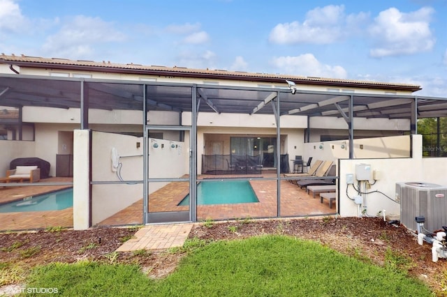 8806 Geneve Ct, Kissimmee, FL 34747 - rear view of house featuring a patio area, a lanai, an outdoor pool, and stucco siding
