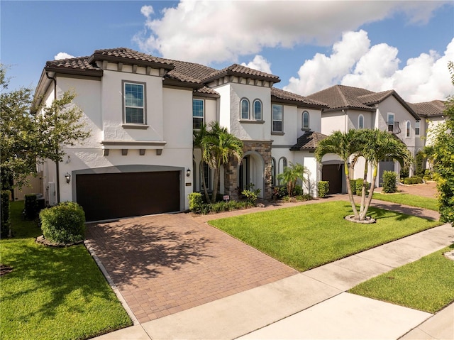 8066 Ludington Cir, Orlando, FL 32836 - mediterranean / spanish home featuring decorative driveway, a garage, stucco siding, and a tiled roof