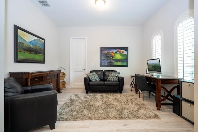 8066 Ludington Cir, Orlando, FL 32836 - living room with healthy amount of natural light, a desk, and light wood finished floors