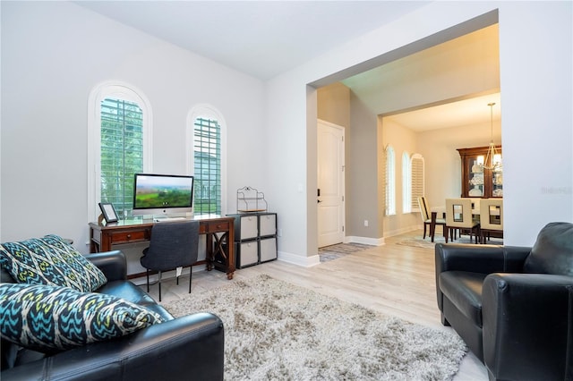 8066 Ludington Cir, Orlando, FL 32836 - office space with a chandelier and wood finished floors