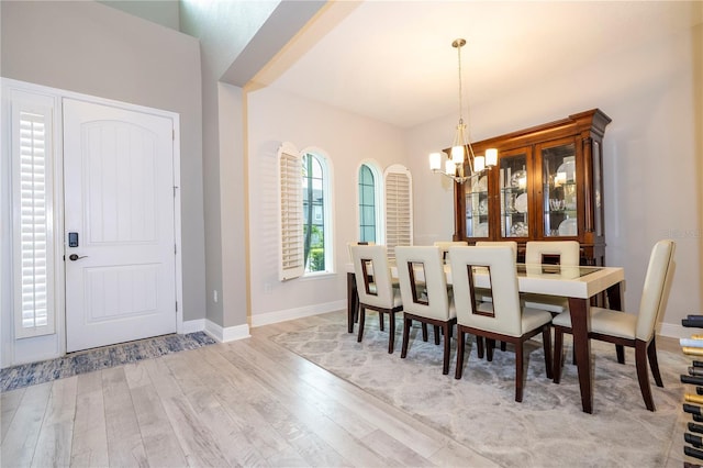 8066 Ludington Cir, Orlando, FL 32836 - dining room with a chandelier and wood finished floors