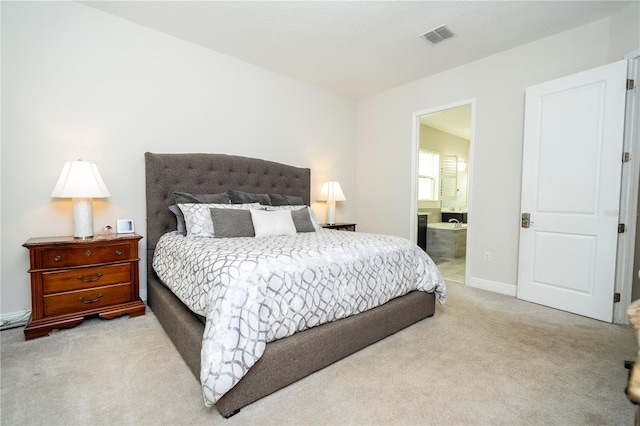 8066 Ludington Cir, Orlando, FL 32836 - bedroom featuring light colored carpet and ensuite bath