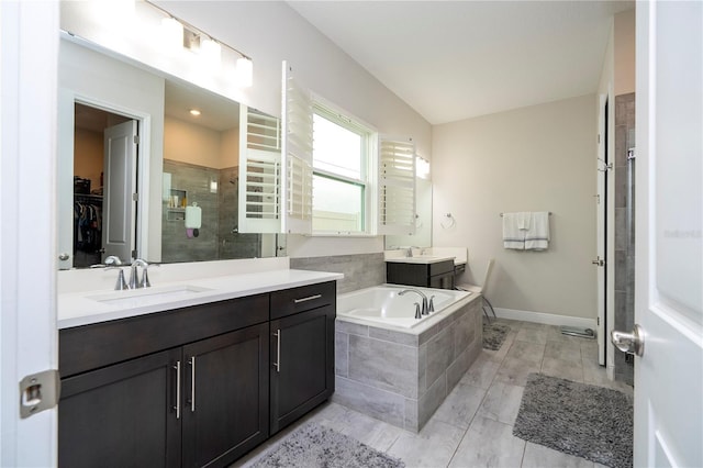 8066 Ludington Cir, Orlando, FL 32836 - full bathroom featuring a stall shower, a garden tub, vanity, a spacious closet, and radiator