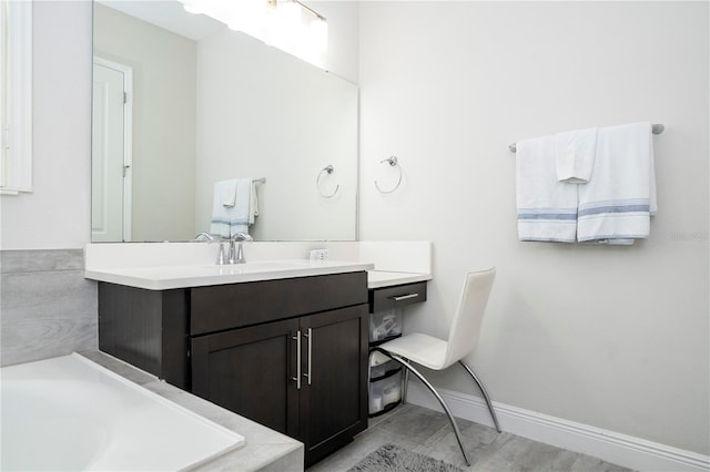8066 Ludington Cir, Orlando, FL 32836 - bathroom featuring a tub to relax in and vanity