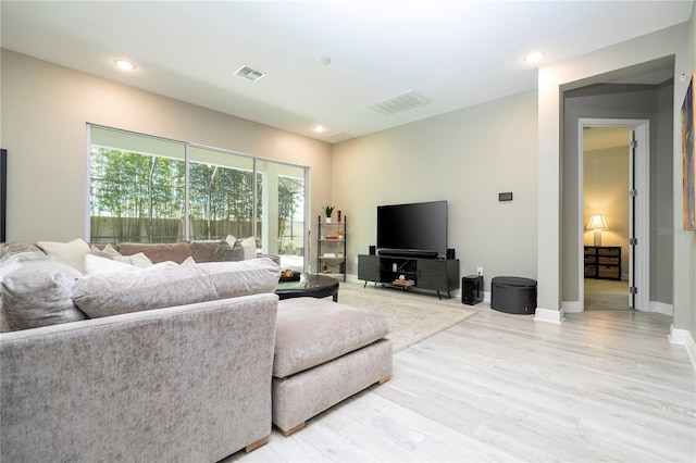 8066 Ludington Cir, Orlando, FL 32836 - living room featuring light wood-style floors and recessed lighting