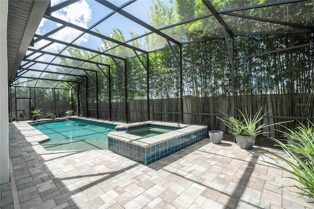 8066 Ludington Cir, Orlando, FL 32836 - view of pool with a lanai, a patio area, a pool with connected hot tub, and a fenced backyard