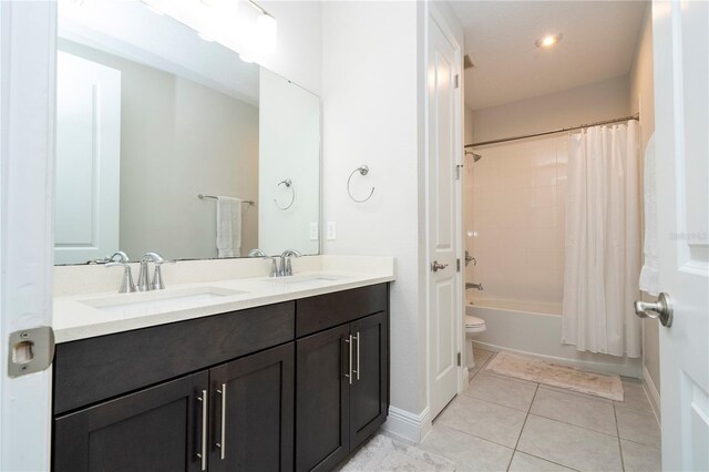 8066 Ludington Cir, Orlando, FL 32836 - bathroom with double vanity, tile patterned flooring, and shower / bath combo with shower curtain