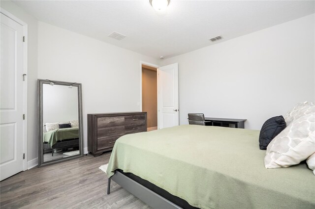 8066 Ludington Cir, Orlando, FL 32836 - bedroom featuring wood finished floors