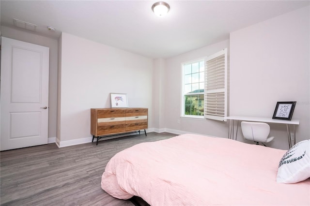 8066 Ludington Cir, Orlando, FL 32836 - bedroom featuring baseboards and wood finished floors