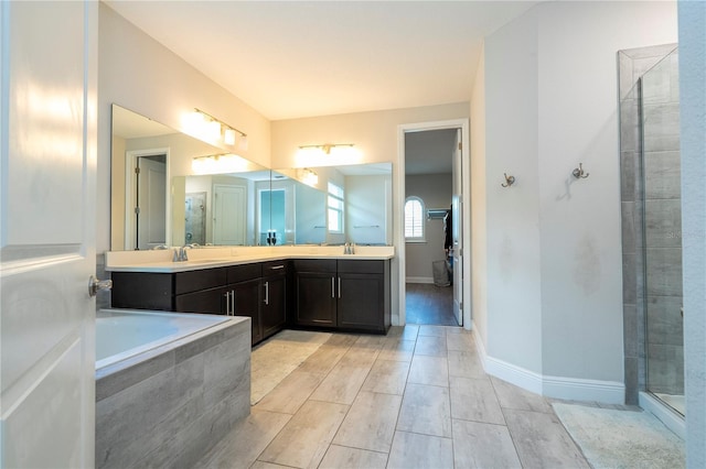 8066 Ludington Cir, Orlando, FL 32836 - bathroom with double vanity, tiled shower, and wood finish floors