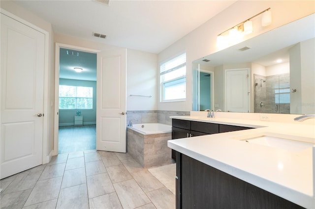 8066 Ludington Cir, Orlando, FL 32836 - full bathroom with double vanity, a garden tub, and a shower stall