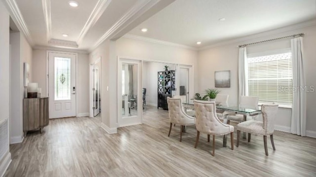 279 SW Cadence Gln, Lake City, FL 32024 - dining space with light wood-style flooring, recessed lighting, ornamental molding, and french doors