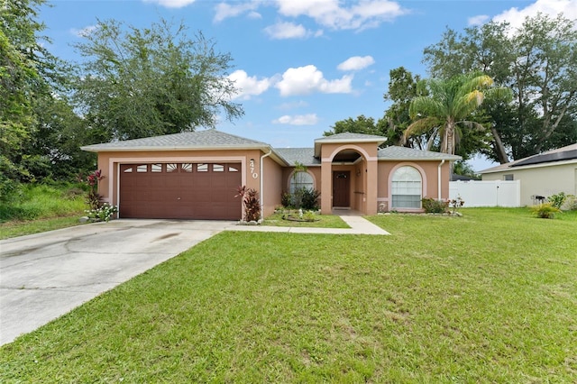 470 Cardinal Ct, Kissimmee, FL 34759 - view of front of home with a garage, stucco siding, driveway, and a shingled roof