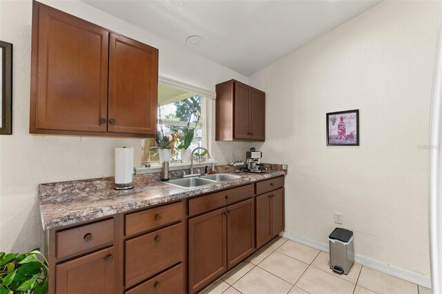 470 Cardinal Ct, Kissimmee, FL 34759 - kitchen featuring a sink and light tile patterned floors