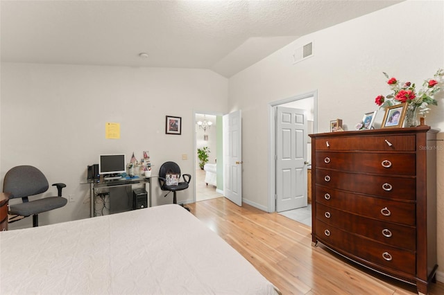 470 Cardinal Ct, Kissimmee, FL 34759 - bedroom with vaulted ceiling, light wood-style floors, an office area, and a chandelier