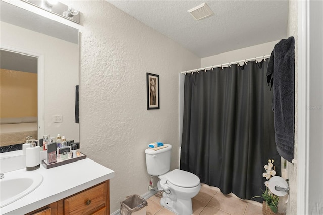470 Cardinal Ct, Kissimmee, FL 34759 - full bathroom with vanity, a textured wall, tile patterned flooring, a textured ceiling, and curtained shower