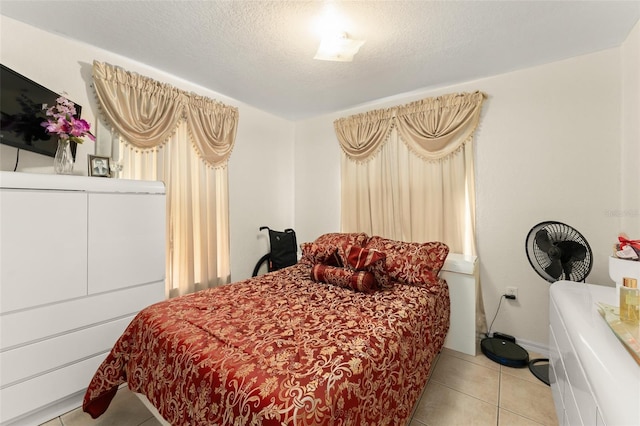 470 Cardinal Ct, Kissimmee, FL 34759 - bedroom with light tile patterned floors and a textured ceiling