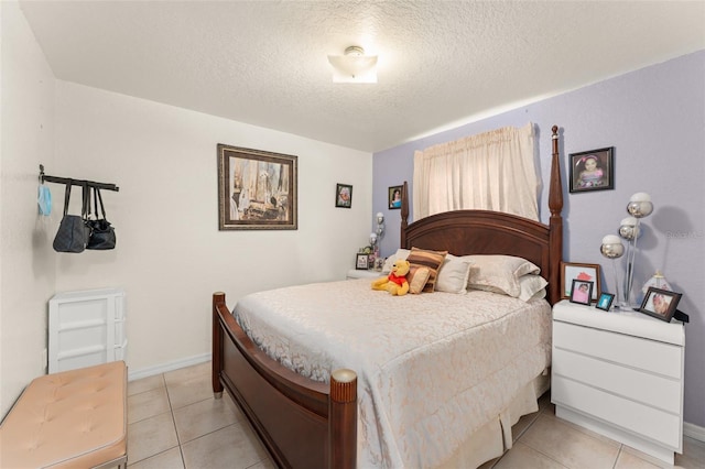 470 Cardinal Ct, Kissimmee, FL 34759 - bedroom with a textured ceiling and light tile patterned floors