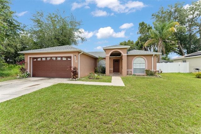 470 Cardinal Ct, Kissimmee, FL 34759 - mediterranean / spanish home with an attached garage, driveway, and stucco siding