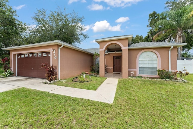 470 Cardinal Ct, Kissimmee, FL 34759 - view of front of property with stucco siding, concrete driveway, and a garage