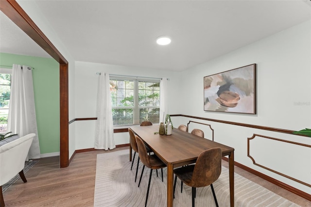 473 Burnt Tree Ln, Apopka, FL 32712 - dining room with light wood-style floors and baseboards