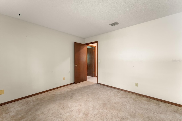 473 Burnt Tree Ln, Apopka, FL 32712 - unfurnished room with light carpet and a textured ceiling