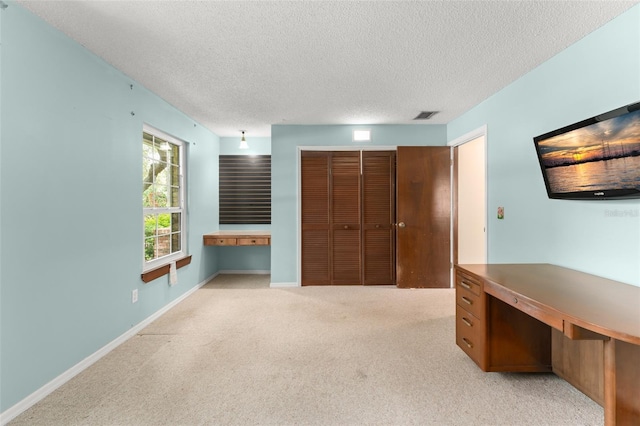 473 Burnt Tree Ln, Apopka, FL 32712 - unfurnished office featuring a textured ceiling, light colored carpet, and built in study area