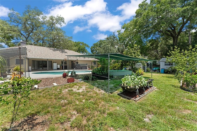 473 Burnt Tree Ln, Apopka, FL 32712 - back of house featuring an outdoor pool, a lawn, and a chimney
