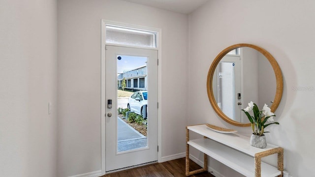 2008 Monteverde Ave, Davenport, FL 33837 - doorway to outside with dark wood-type flooring and baseboards