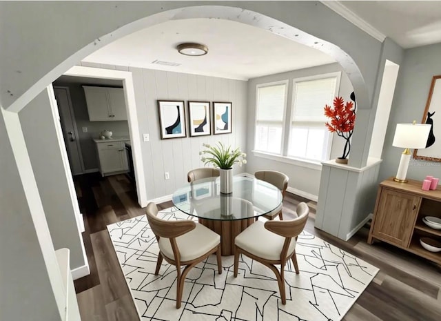 2107 Hollywood Ave, Eustis, FL 32726 - dining room with wood finished floors and arched walkways