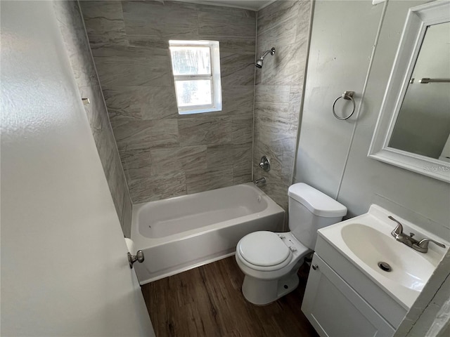 2107 Hollywood Ave, Eustis, FL 32726 - bathroom featuring wood finished floors, washtub / shower combination, and vanity