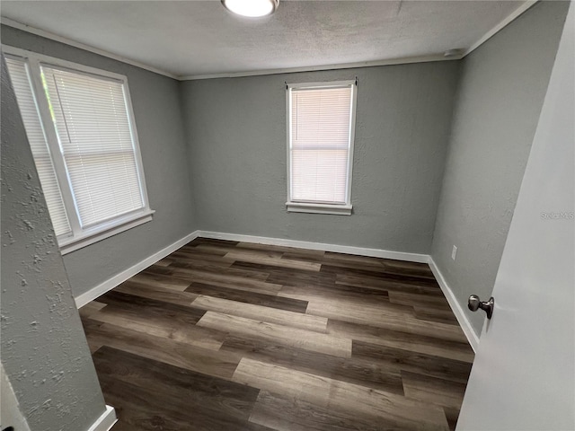 2107 Hollywood Ave, Eustis, FL 32726 - spare room featuring dark wood-type flooring and baseboards