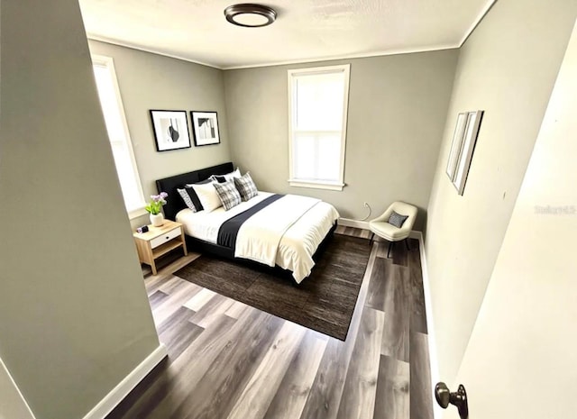 2107 Hollywood Ave, Eustis, FL 32726 - bedroom featuring wood finished floors and baseboards