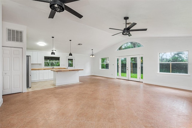 4085 Cypress Bnd, Geneva, FL 32732 - unfurnished living room with a ceiling fan, lofted ceiling, and french doors