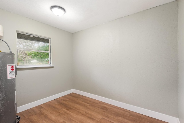 4085 Cypress Bnd, Geneva, FL 32732 - empty room featuring wood finished floors and water heater