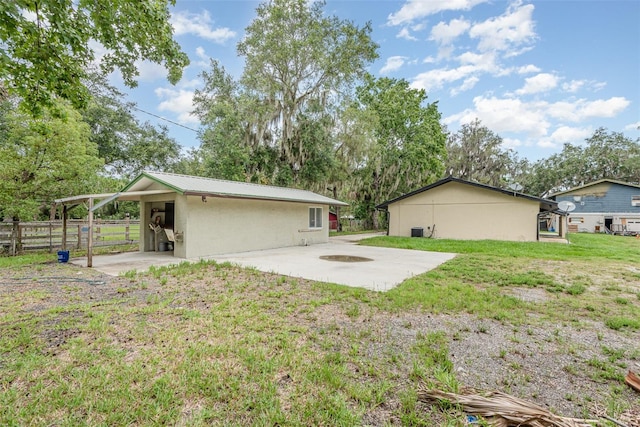 4085 Cypress Bnd, Geneva, FL 32732 - rear view of house with a patio and a metal roof