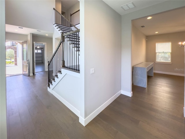 16210 Ravenna Ct, Montverde, FL 34756 - corridor featuring stairs, wood finished floors, recessed lighting, and a chandelier