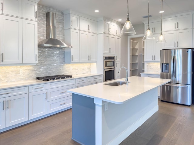 16210 Ravenna Ct, Montverde, FL 34756 - kitchen featuring stainless steel appliances, wall chimney exhaust hood, dark wood finished floors, recessed lighting, and light countertops