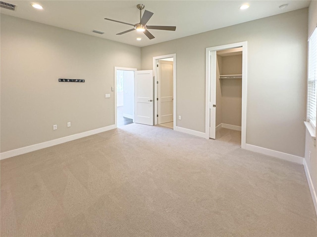 16210 Ravenna Ct, Montverde, FL 34756 - unfurnished bedroom featuring light carpet, recessed lighting, a walk in closet, and ceiling fan