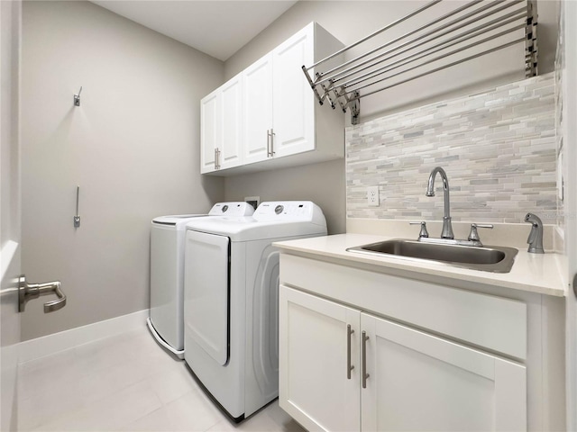 16210 Ravenna Ct, Montverde, FL 34756 - washroom with washing machine and dryer, cabinet space, and light tile patterned floors