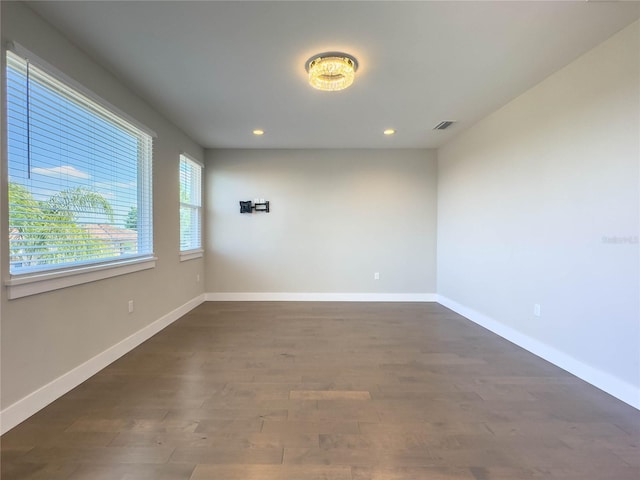 16210 Ravenna Ct, Montverde, FL 34756 - unfurnished room with dark wood-style flooring and recessed lighting