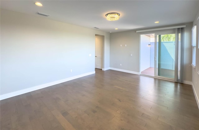 16210 Ravenna Ct, Montverde, FL 34756 - empty room with dark wood-style flooring and recessed lighting