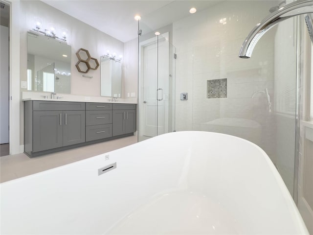 16210 Ravenna Ct, Montverde, FL 34756 - full bathroom featuring a soaking tub, a shower stall, and double vanity
