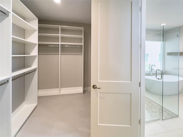 16210 Ravenna Ct, Montverde, FL 34756 - spacious closet featuring light tile patterned floors