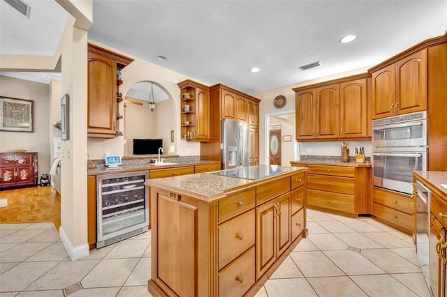 413 Harbour Oaks Pointe Dr, Edgewood, FL 32809 - kitchen featuring wine cooler, open shelves, stainless steel appliances, a kitchen island, and light tile patterned flooring