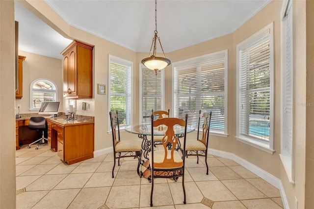 413 Harbour Oaks Pointe Dr, Edgewood, FL 32809 - dining area featuring light tile patterned floors, crown molding, and an office area